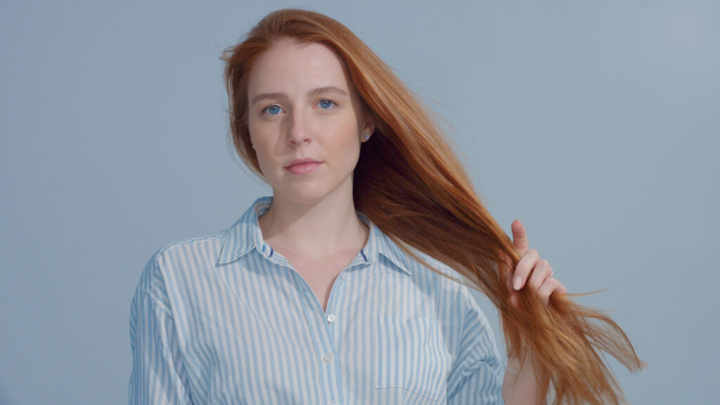 gingerhead red hair, ginger hair model with blue eyes on blue background